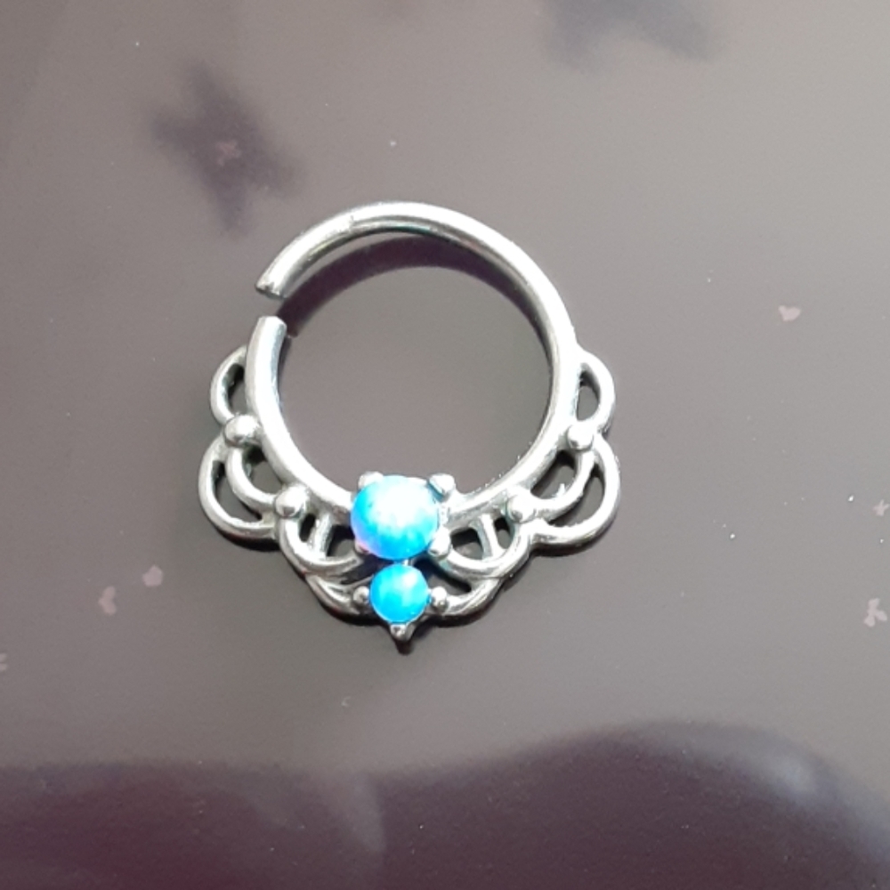 Never worn septum ring w/ blue gem